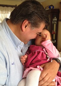 Ariel Garcia is holding the 11-month-old Geraldine Ariana Suarez
