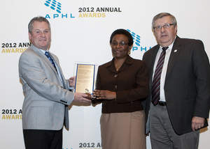 Director, Onesia Bishop, of the New Jersey Public Health and Environmental Laboratory (NJPEL), accepts the 2012 APHL Gold Standard Award on behalf of the entire laboratory.