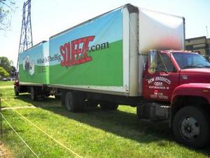 New Products trucks display banner on company's proprety across from VIP entrance to the Senior PGA at Harbor Shores in Benton Harbor, Mich.
