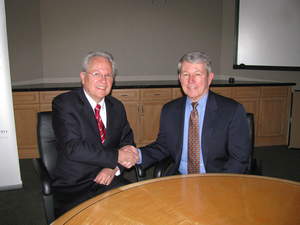 Spintrac Systems President Alan Kukas, left, and SEMI President and CEO Dennis McGuirk discuss upcoming SEMICON West 2012.