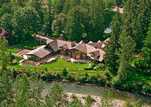 The 14,000 square foot Snoqualmie River Estate sits on 50 acres at the base of Mt. Si. 