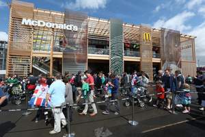 Spectators visit McDonald's flagship restaurant on the Olympic Park, where the company is serving record-breaking crowds. Customer visits are running more than double projections at McDonald's four restaurants -- two on the park for spectators; one in the Athletes' Village and one in the Main Media Center.