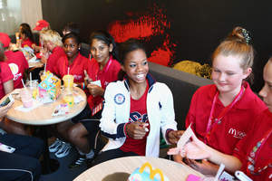 Two-time U.S. Olympic Gold Medal Gymnast Gabby Douglas visited McDonald's flagship restaurant on the Olympic Park. Douglas met with kids participating in the company's "Champions of Play" program to share her Olympic experience. Nearly 200 kids from 34 countries traveled to London to see the Games as part of the program, which encourages a balanced approach to nutrition and activity.  