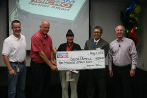 To help support the athletes of the Special Olympics, Ingram Micro Inc. donates $10,000 to the Special Olympics Southern California (SOSC) at recent Associate Appreciation Day. Ingram Micro executives presented the donation to Stephanie Hardy, Special Olympics gold medalist and David Armendariz, regional director, SOSC.