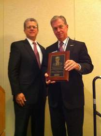 Bill Whitmore, President & CEO, AlliedBarton Security Services accepts the Edgar B. Watson Award at NASCO Annual Private Security Breakfast. Pictured (right) David Buckman, EVP and General Counsel, AlliedBarton, and Bill Whitmore (left).
