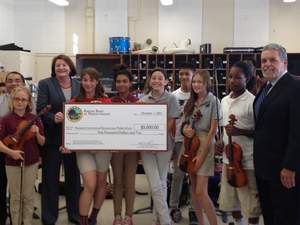 The Barona Band of Mission Indians on Monday presented the faculty and students of Roosevelt Middle School with a grant that will be used to purchase musical instruments. From left: Roosevelt Middle School Principal Arturo Cabello; Assemblywoman Toni Atkins; Barona Band of Mission Indians Chairman Edwin 'Thorpe' Romero.