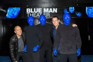 Blue Man Group poses with founders Chris Wink and Phil Stanton after skydiving into their new home at Monte Carlo Resort and Casino. (photo credit: Erik Kabik)