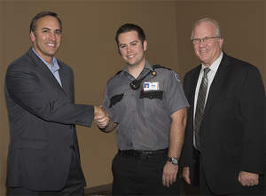 In this photo released by Red Hawk Casino pictured left to right: Bryan deLugo, General Manager; Tyler Ebinger, First Responder; Pat Farrington, Vice President of Security