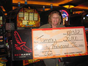 Tammy, from Shingle Springs, Calif., celebrates her $20,000 jackpot at Red Hawk Casino.