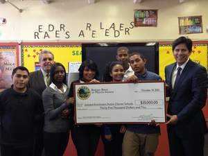 The Barona Band of Mission Indians presented Soledad Enrichment Action Charter School students and faculty with $35,000 in grant money to build up technology on seven of the system's campuses. From left: Barona Band of Mission Indians Chairman Edwin 'Thorpe' Romero, SEA students and California State Senator Kevin De Leon. 
