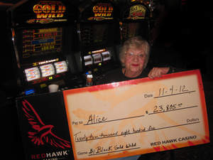 Alice celebrates a $23,805 slot jackpot win at Red Hawk Casino.