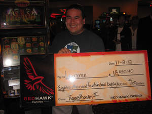 Lawrence, from San Jose, Calif., celebrates a $18,482 jackpot at Red Hawk Casino.