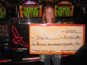Sheila, from Diamond Springs, Calif., celebrates a $10,350 slot jackpot at Red Hawk Casino.