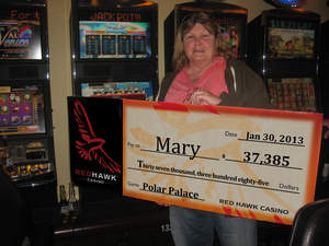 Mary celebrates her a $37,385 slot jackpot at Red Hawk Casino