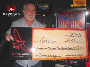 George, from Wilton, Calif., celebrates a $83,586 slot jackpot at Red Hawk Casino.