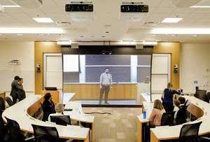 In the Cisco Connected Classroom, students attending class virtually see a life-size, floor-to-ceiling view of the professor teaching on the opposite coast.
