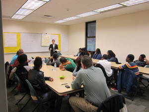 Anthony Pili teaching money management to teens