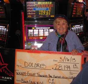 Dolores, from Vacaville, Calif., celebrates a $28,194 jackpot on a penny slot machine at Red Hawk Casino.