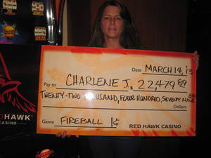 Charlene, from Fair Oaks, Calif., celebrates a $22,479 penny slot jackpot at Red Hawk Casino in Placerville.