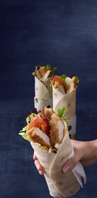 All three varieties of the tortilla-wrapped entree feature fresh vegetables, grilled or crispy chicken breast along with signature sauces such as seasoned rice vinegar, sweet chili, or creamy garlic served in a convenient hand-held package designed for eating on-the-go.