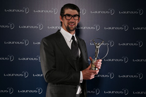 Michael Phelps receives the Laureus Academy Exceptional Achievement Award at the 2013 Laureus World Sports Awards at the Theatro Municipal Do Rio de Janeiro on March 11, 2013 in Rio de Janeiro, Brazil.