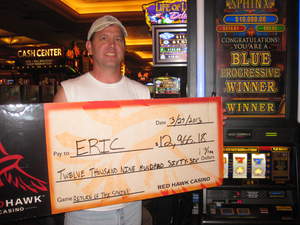 Eric, from Sacramento, Calif., celebrates his $12,966 slot jackpot win at Red Hawk Casino.