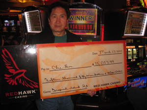 Chi Lam, from Pinole, Calif., celebrates a $15,057 slot jackpot at Red Hawk Casino.