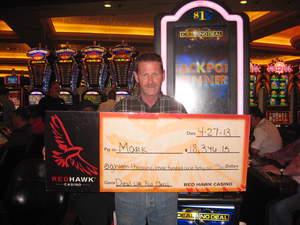 Mark, from Santa Clara, Calif., celebrates an $18,346 slot jackpot at Red Hawk Casino.