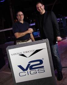 Larry Wexler, President and CEO of National Tobacco Company alongside Andries Verleur, CEO and Co-Founder of V2 Cigs, announcing their strategic partnership.