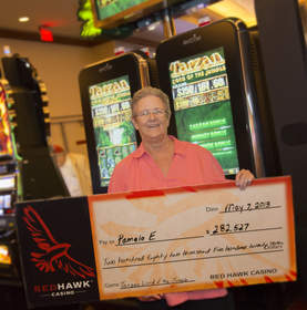 Pamela, from Carmichael, Calif. celebrates a $282,527 penny slot jackpot at Red Hawk Casino.