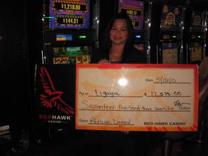 Ligaya, from Pacifica, Calif., celebrates a $17,375 slot jackpot at Red Hawk Casino.