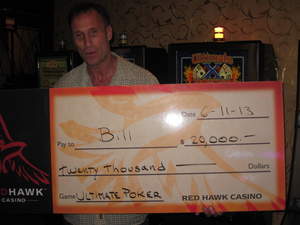 William, from Sacramento, Calif., celebrates a $20,000 slot jackpot at Red Hawk Casino.