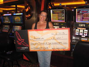 Angela, from Fair Oaks, Calif., celebrates a $51,580 slot jackpot at Red Hawk Casino.