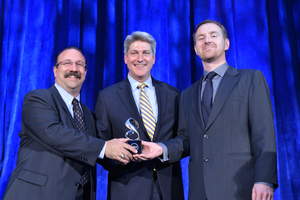 Vicor's Robert DeRobertis, director of corporate marketing and communications (left), and Stephen Oliver, vice president VI Chip product line (right), accepting the TechAmerica Foundation American Technology Award on June 20, 2013 (photo credit: Eddie Arrossi)