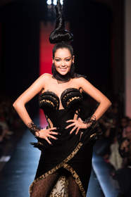 Nabilla, the new face of Jean-Paul Gaultier, walks the catwalk at Paris Fashion Week 2013.