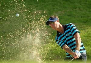 The world's longest hitter Nicolas Colsaerts blasts out of a Borneo bunker at the latest edition of the Royal Trophy