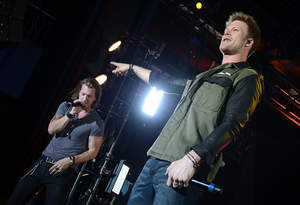Tyler Hubbard and Brian Kelley of CMA Award Winning Duo Florida Georgia Line perform at The Billboard Touring Conference 10th Anniversary Concert Presented By Citi on November 13, 2013 in New York City. (Photo by Theo Wargo/Getty Images for Citi)