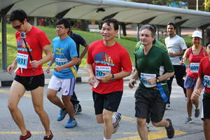 Guest of Honour Mr Yam Ah Mee (centre) running in the 5km event.