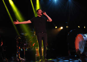 Dan Reynolds of Imagine Dragons performs on stage at Citi Presents an Exclusive Performance by Imagine Dragons for Citi ThankYou Cardmembers, benefiting the Grammy Foundation, on Thursday, Jan. 23, 2014 at the Wiltern Theatre in Los Angeles. (Photo by John Shearer/Invision for Citi/AP Images)