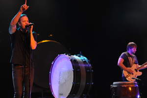 Dan Reynolds of Imagine Dragons, left, performs on stage at Citi Presents an Exclusive Performance by Imagine Dragons for Citi ThankYou Cardmembers, benefiting the Grammy Foundation, on Thursday, Jan. 23, 2014 at the Wiltern Theatre in Los Angeles. (Photo by John Shearer/Invision for Citi/AP Images)