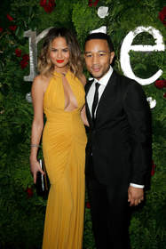 WEST HOLLYWOOD, CA - JANUARY 25:  Model Christine Teigen (L) and singer/songwriter John Legend attend the Nielsen Pre-GRAMMY Party at Mondrian Los Angeles on January 25, 2014 in West Hollywood, California.  (Photo by Joe Scarnici/Getty Images for MAC Presents)