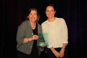 PHOTO CAPTION: Kate Ringe-Welch of National Grid accepts the Outstanding Achievement in Social Media Award from Sara Van De Grift, President of the Board, Association of Energy Service Professionals, at the annual AESP Conference in San Diego, CA. Ringe-Welch accepted the award on behalf of the Sponsors of Mass Save.
