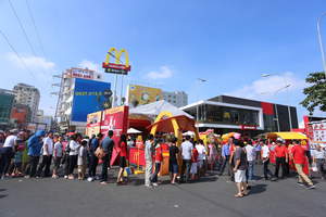 (Ho Chi Minh City -- February 10, 2014) -- Today, McDonald's opens its first restaurant in Vietnam, which also marks the 10,000th restaurant for the chain in the Asia, Pacific, Middle East, and Africa region. Customers wait in long lines for their first McDonald's experience on Opening Day