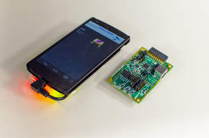 QuickLogic Sensor Development Board Shown Attached to Android KitKat Phone