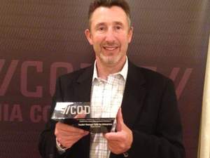 SVP of Products and Services, Richard Northing, accepts Flexera Software's CODiE Award