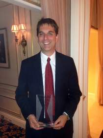 Tom Reichert with his Top 25 Consultants award for Excellence in Leadership.