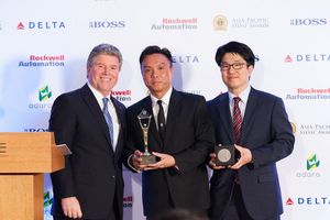 Sean Kwek and YongJae Kang of Arkadin accept Stevie Award Trophies for Fastest Growing Company of the Year and Customer Service Leadership