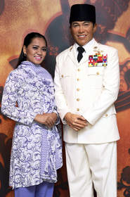 Soekarno is dressed in his trademark white military uniform
