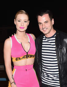 Singer Iggy Azalea and Pandora VP Tommy Page attend Pandora Presents on the Santa Monica Pier on August 9, 2014 in Santa Monica, California.  (Photo by Michael Buckner/Getty Images for Pandora)