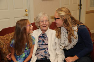Sue Wright enjoys a lively conversation with granddaughters, Ella Wright, at left, and Savannah Wright.